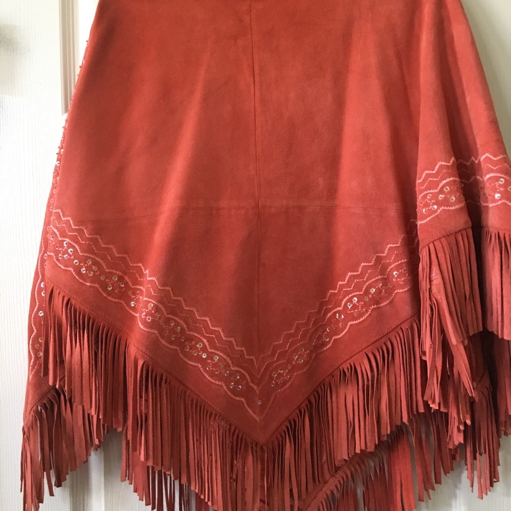 Salmon colored poncho